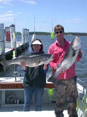 Sara and Brian with a pair of healthy stripers