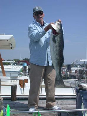 Ron holds on to this fine striper catch!