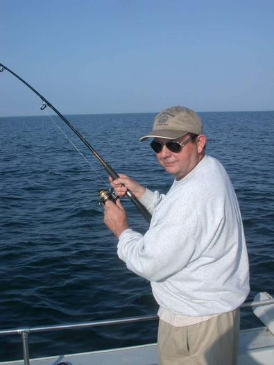 Bill Baker does not let the hard to catch stripers alone, as he hooks another!
