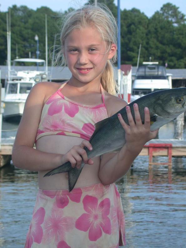 Kayla holds up one of many blues that succumbed to her deadly rod!