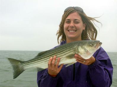 Nikki with the big fish of the day at 25 inches and her first ever fish!