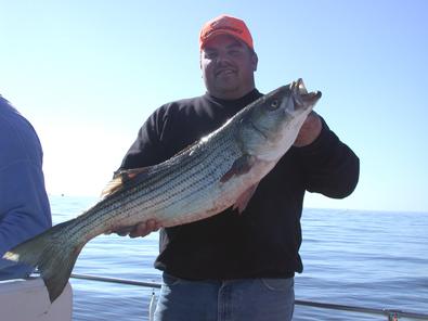 Jason with his first striper and a real beauty at that!