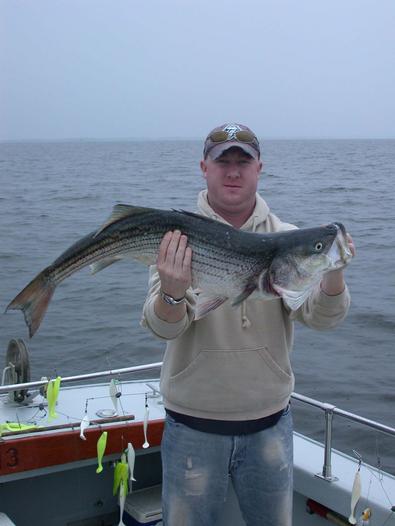 Trevor holds up his big fish of the day!
