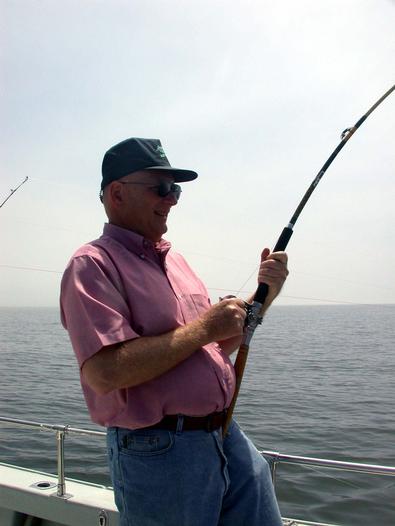 John from Dallas, Texas cranks in his first Chesapeake Bay striper
