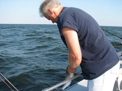 Pastor Dan Mohler hooks another croaker