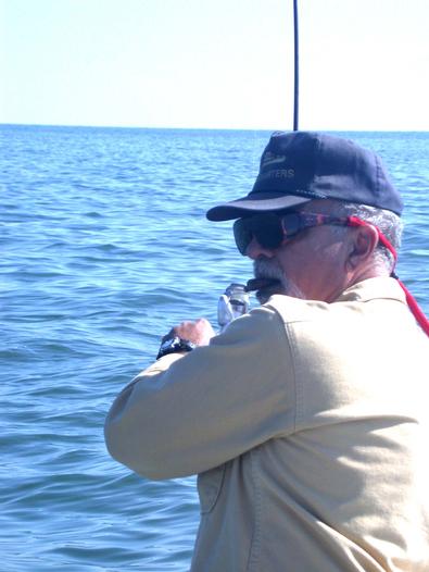Ed hooks up with a striper, again!