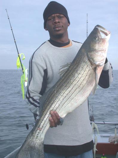 Matt had to practice to catch his first ever striper!