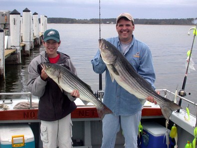 Luke and Dad Kevin pose for this father son shot
