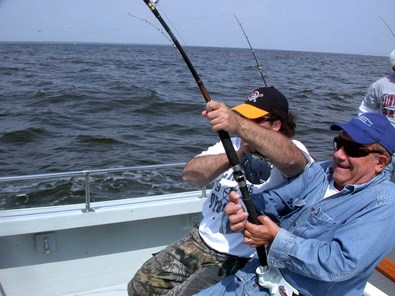 Mike gives Marty a help in hand as they reel in a real big one